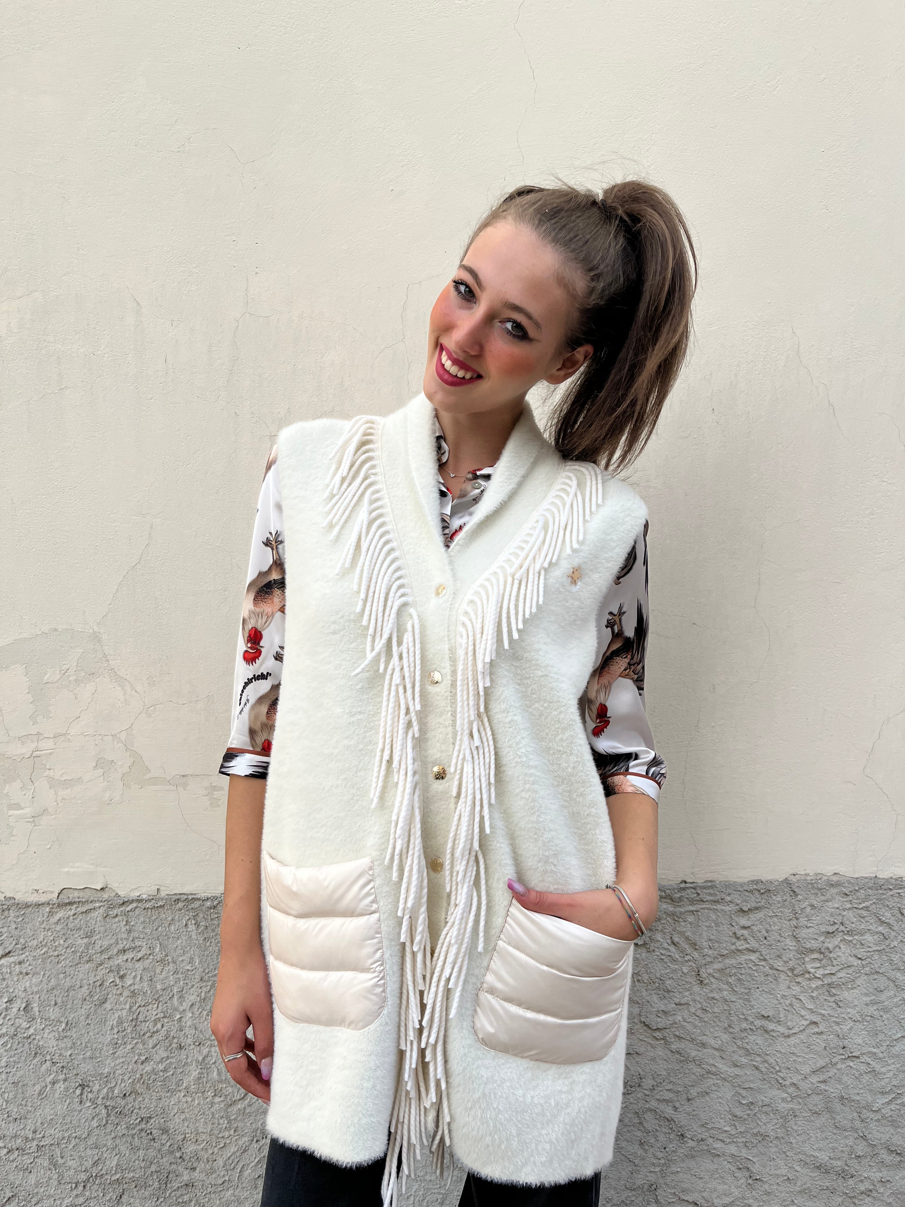 Piumino gilet in maglia con frange