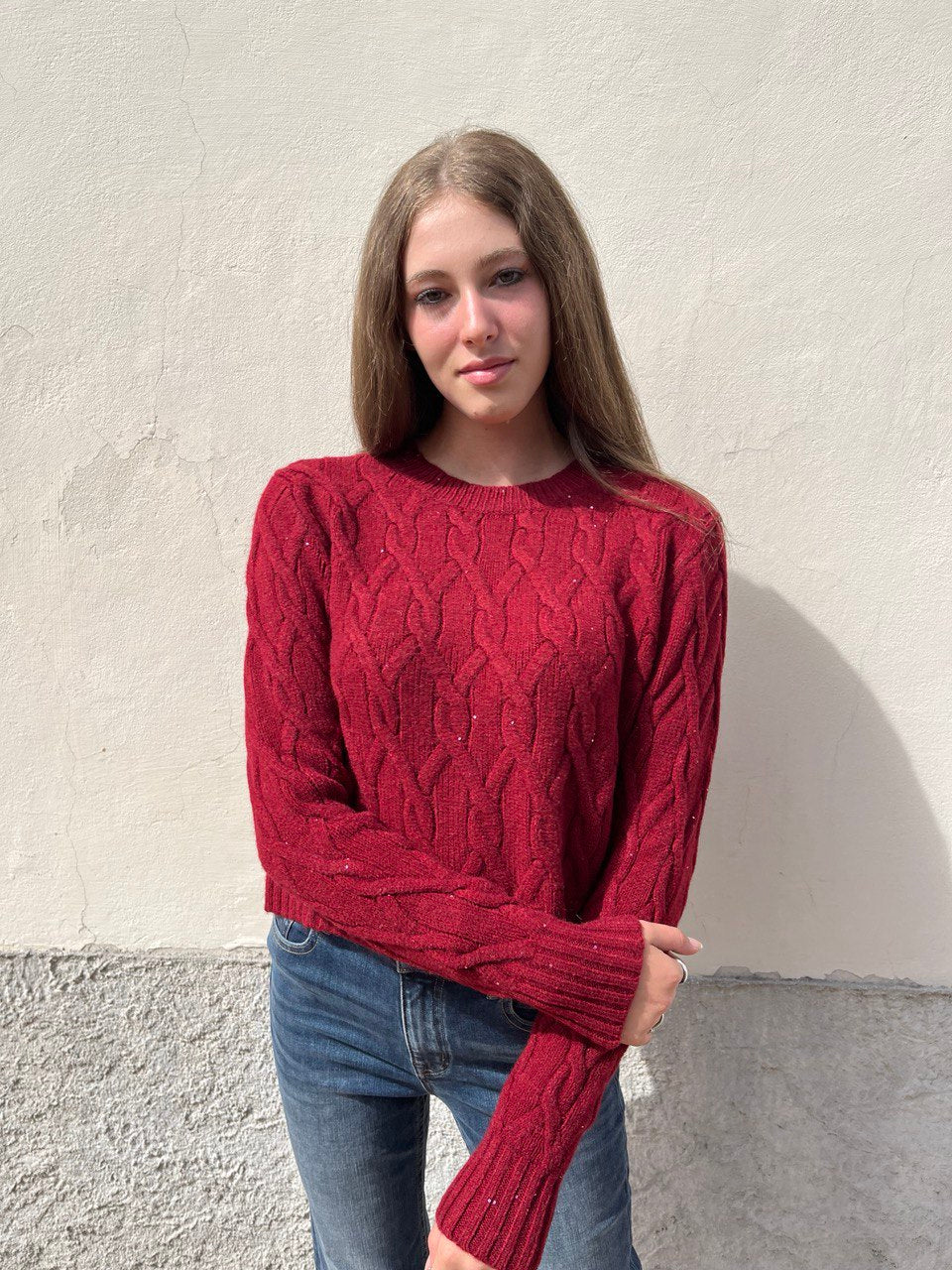 Pull con treccia e pailettes