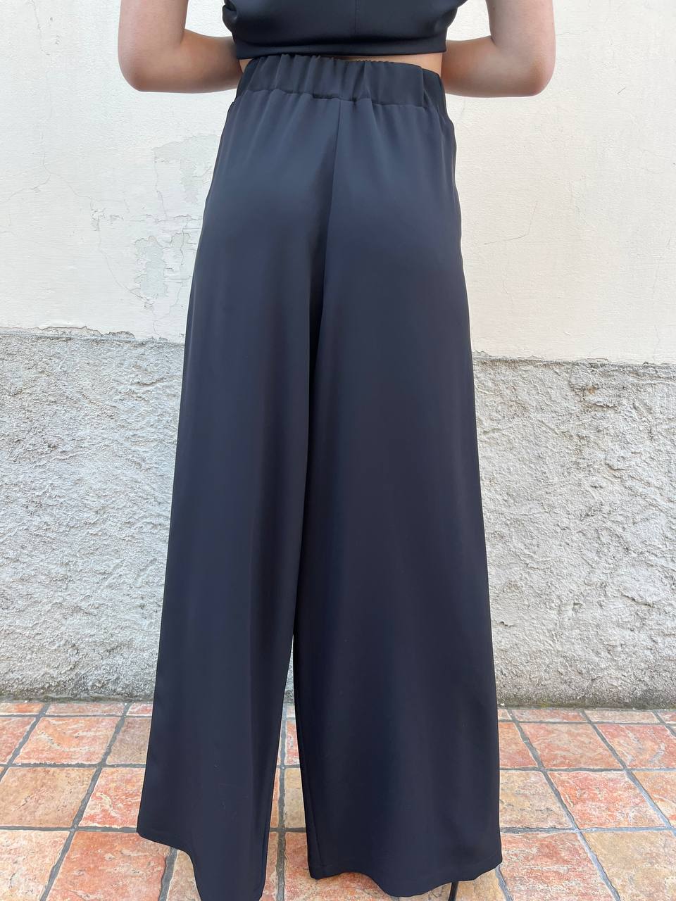 Pantalone palazzo con pence