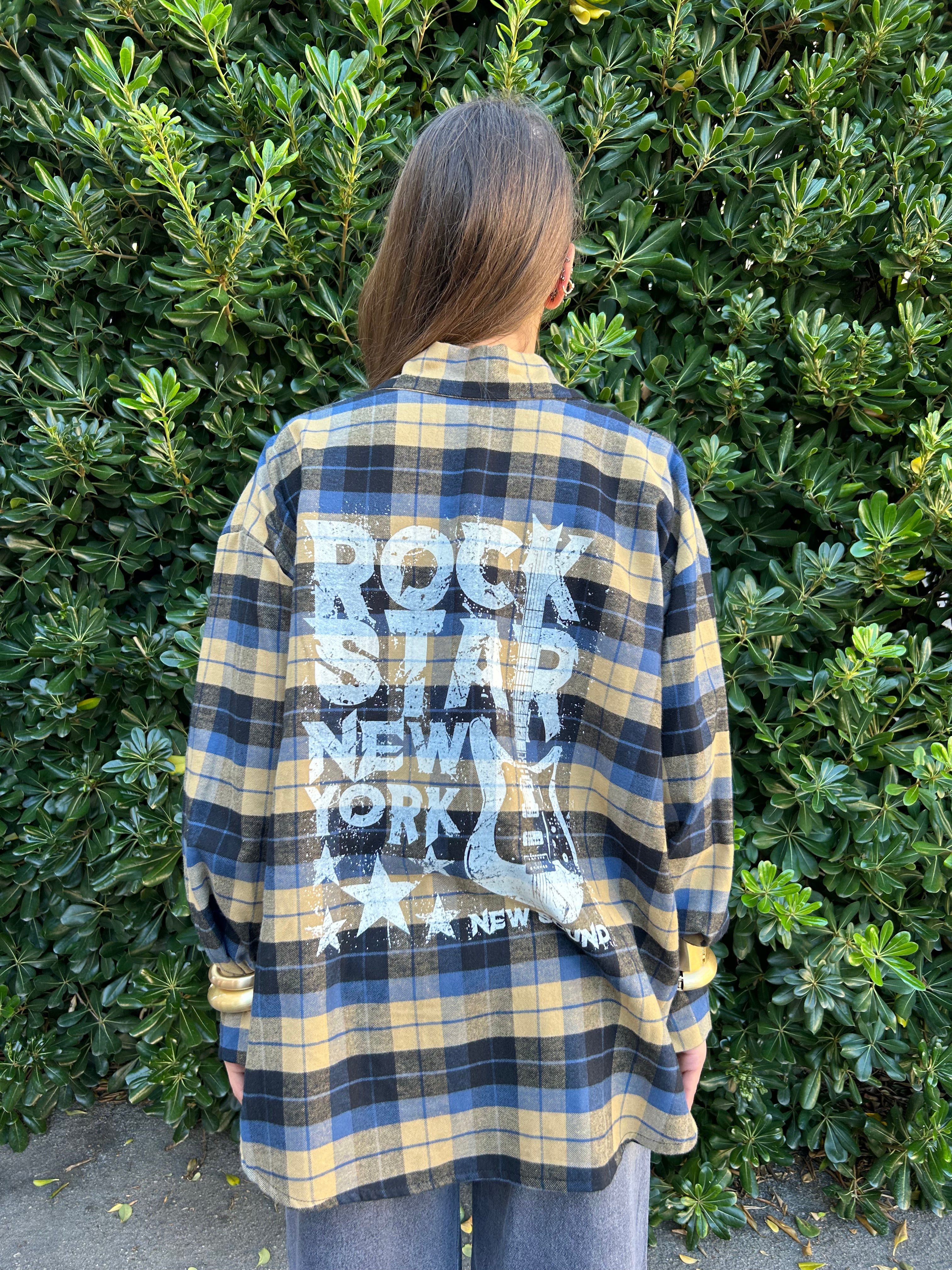 Camicia check con scritta dietro